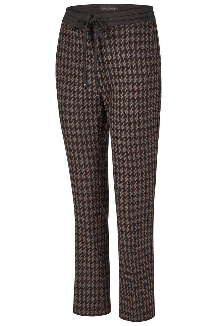 Houndstooth patterned pants on a white background