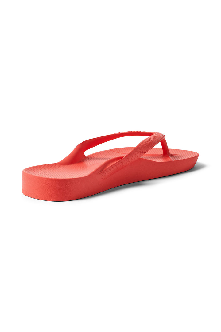 Archies Arch Support Flip Flops Coral, angled side view showing the arch