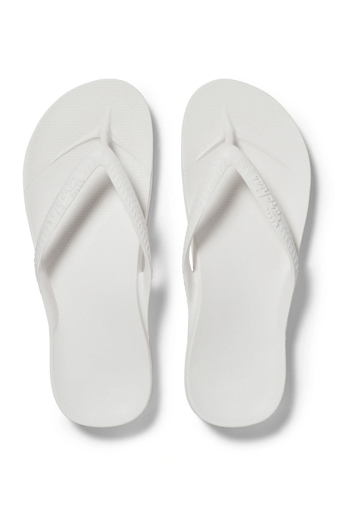 Archies arch support flip flops in white at Shirley Allum