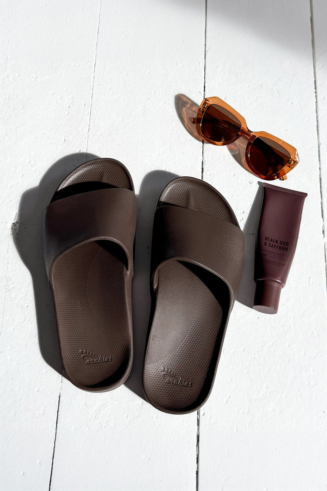 Archies Arch Support Slides Brown, flat lay with sunglasses