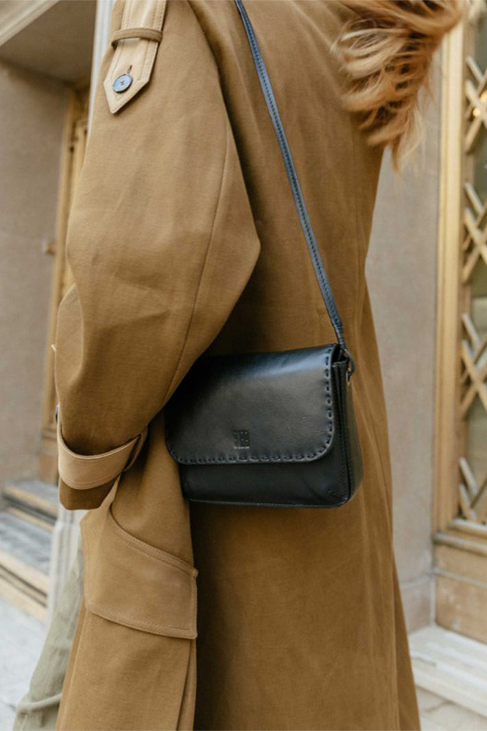 Biba Hatch Black Leather Cross Body Bag HAH1L, worn cross body over a coat