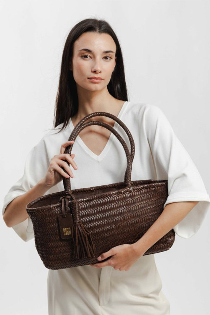 Biba Perkins Dark Brown Woven Leather Shoulder Bag PER10L, carried in the hand