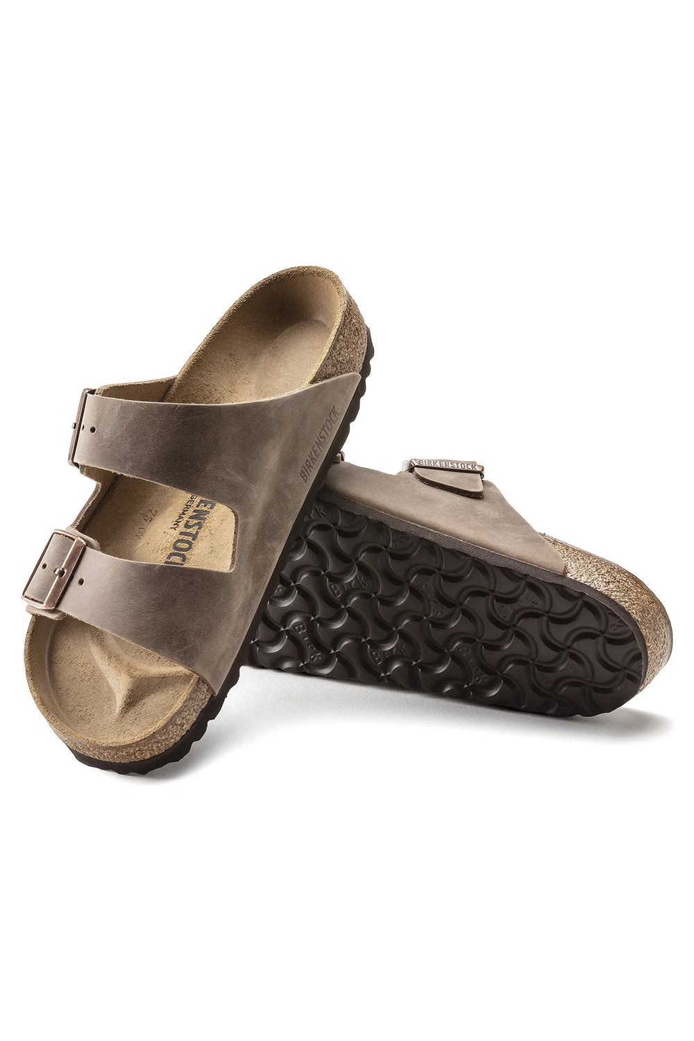 Pair of brown sandals on a white background