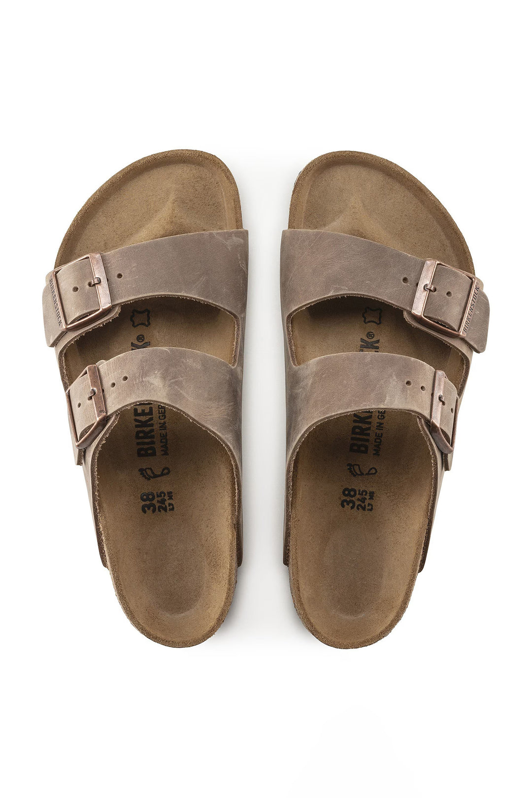 Pair of brown sandals with double buckles on a white background