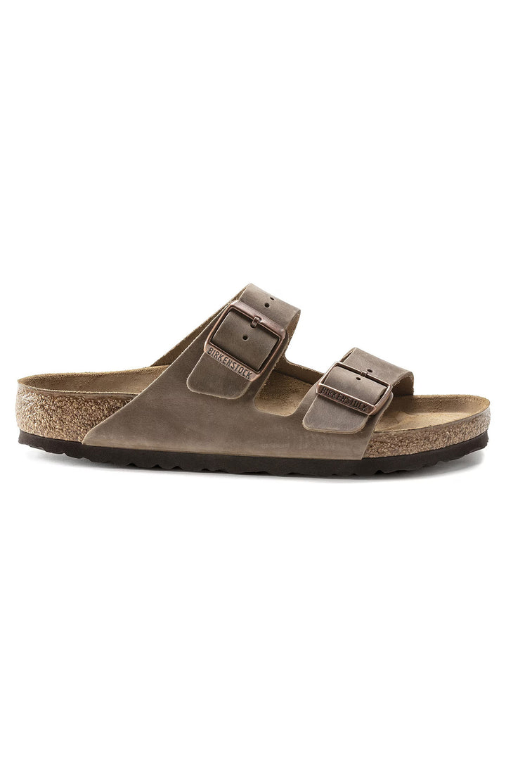 Brown sandal with two straps on a white background