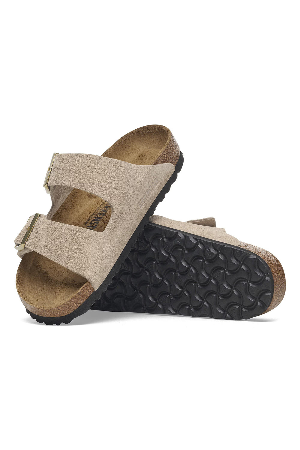Beige sandal with black sole on a white background