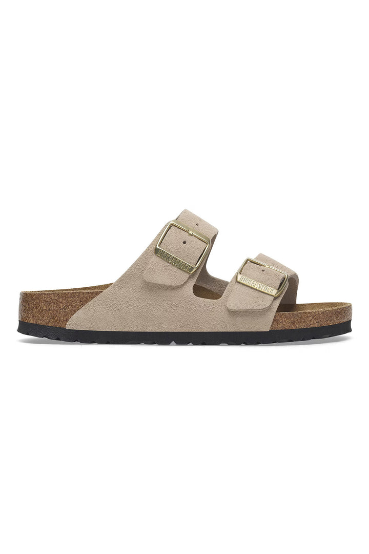Beige sandal with cork sole on a white background