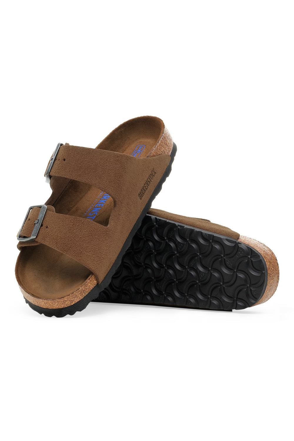 Pair of brown sandals with black soles on a white background