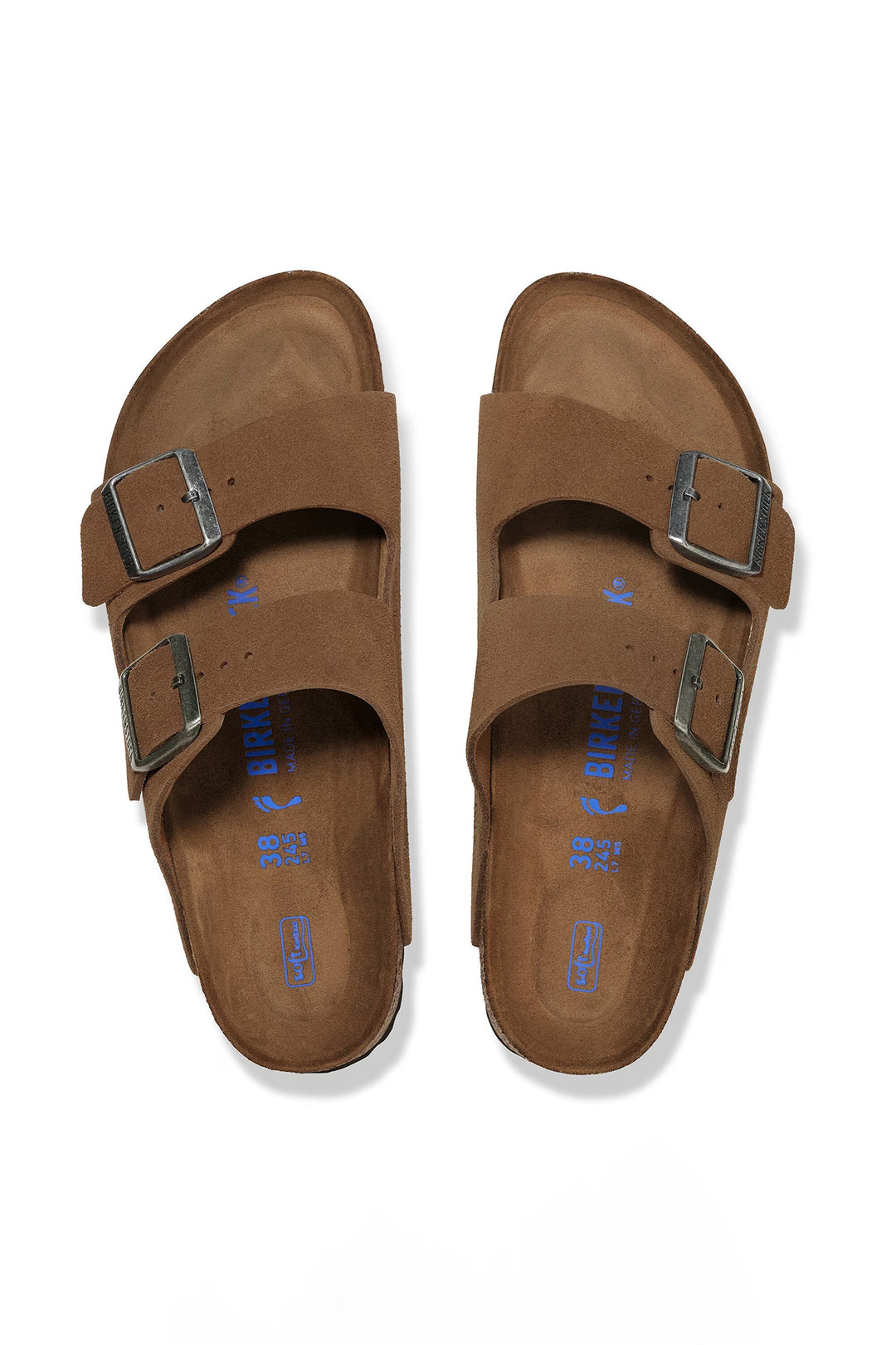 Pair of brown sandals with double straps on a white background