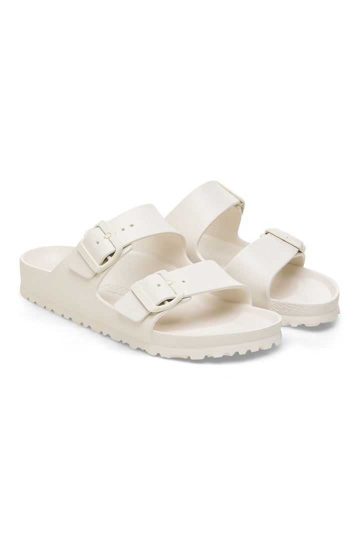 Pair of white sandals on a white background