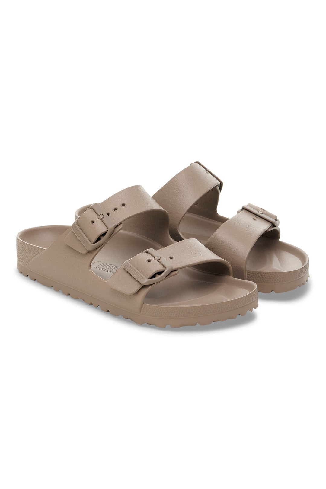 Pair of brown sandals on a white background