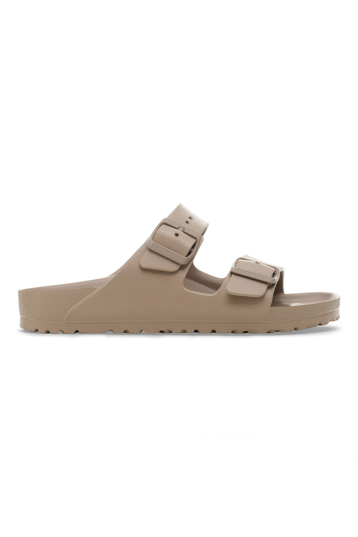 Beige sandal with double strap on a white background