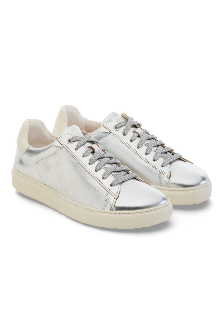 Silver sneakers on a white background