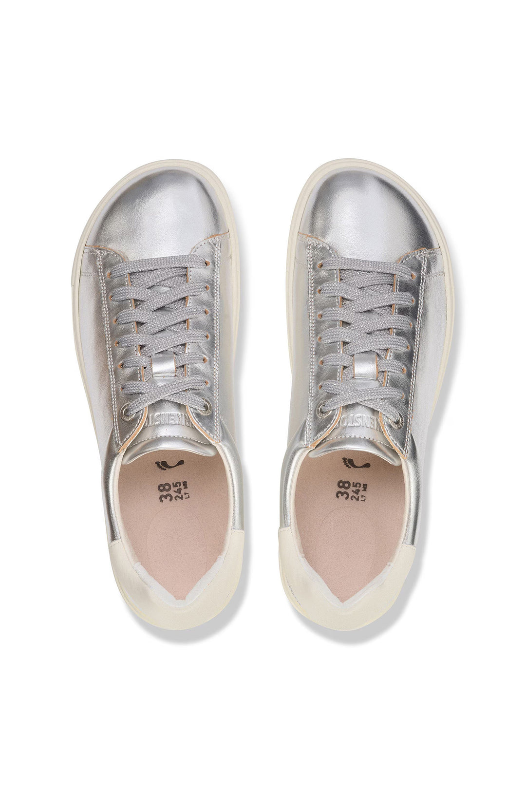 Pair of silver sneakers on a white background