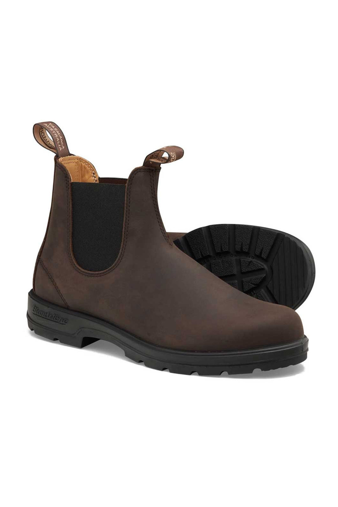 Brown Chelsea boot with black sole on a white background