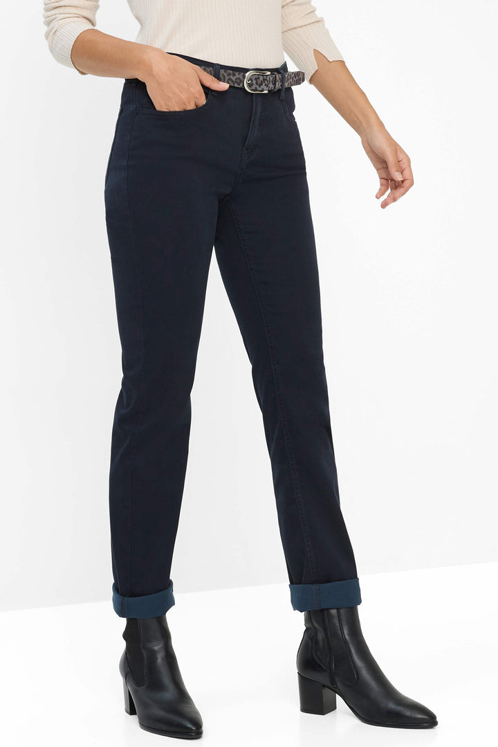 Person wearing navy pants with a white background