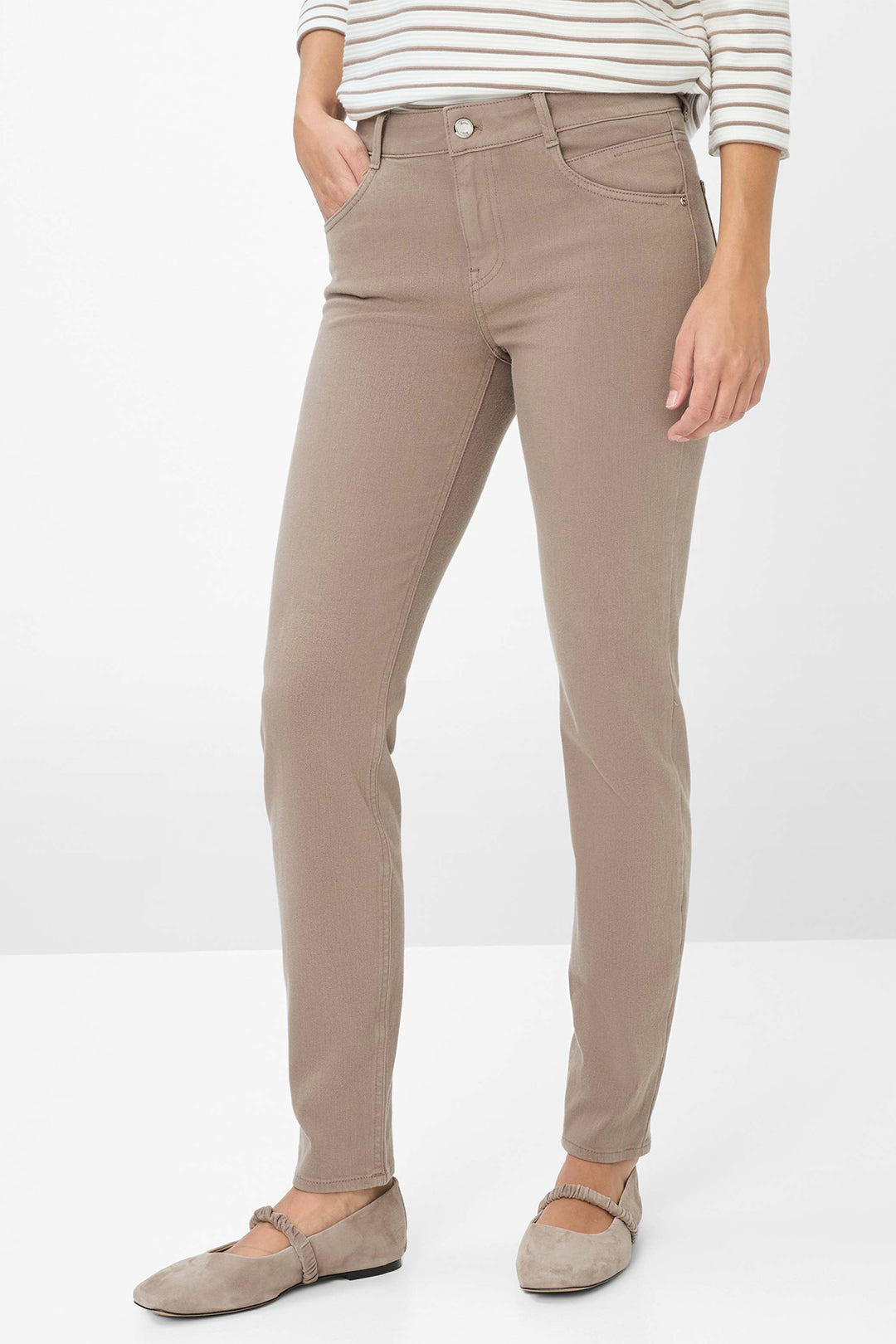 Beige pants worn by a person on a white background