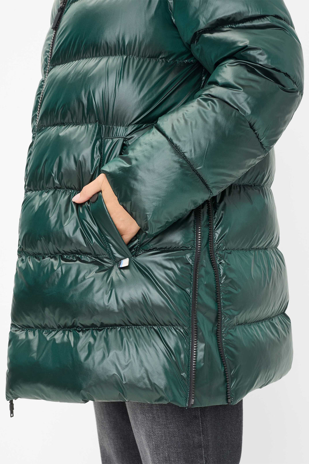 Green puffer coat on a white background