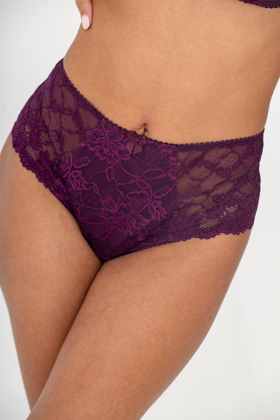 Purple lace underwear on a white background