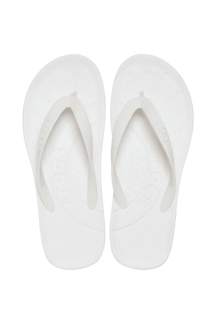 Pair of white slippers on a white background
