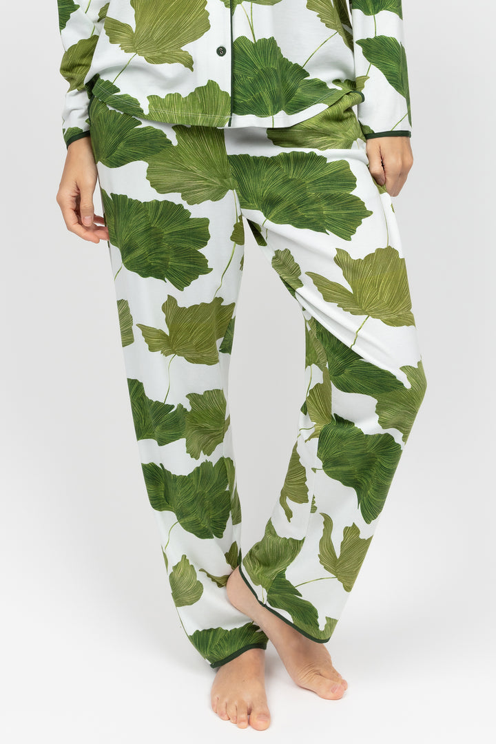 Green leaf-patterned pajama set on a white background