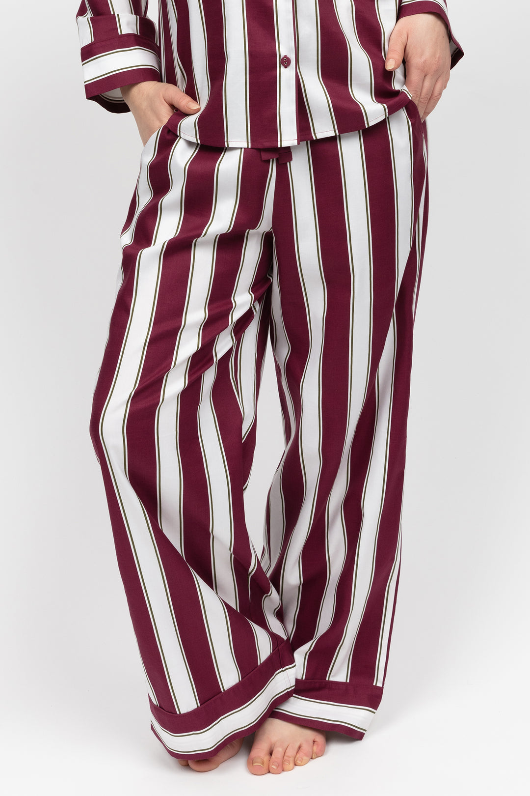 Maroon and white striped pajama set on a white background