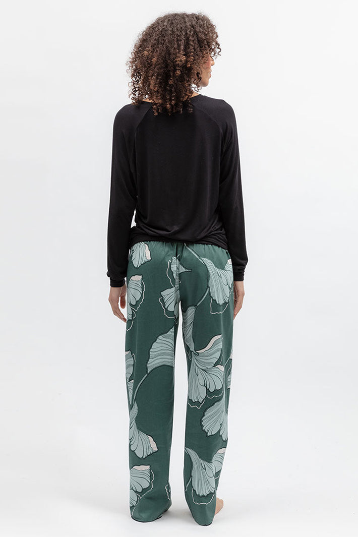 Cyberjammies 5573 Grace Green Floral Print Pyjama Bottoms, back view with a black top