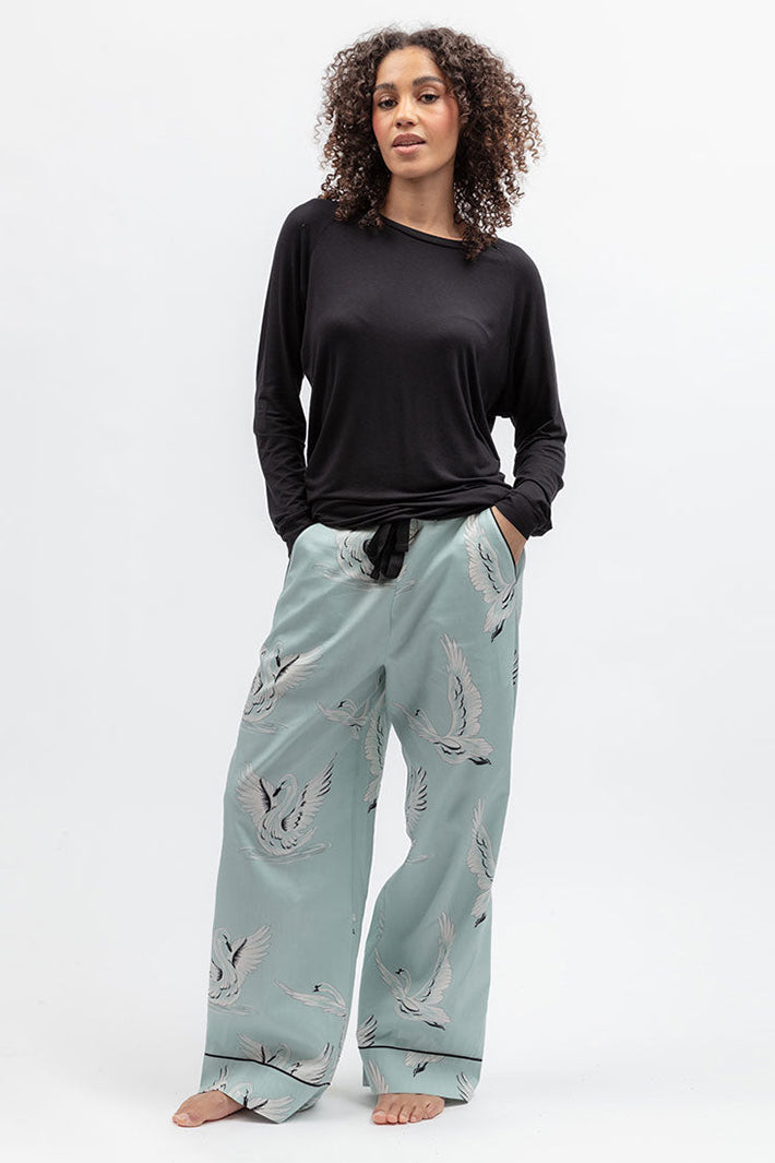 Cyberjammies 5580 Grace Black Slouch Jersey Long Sleeve Pyjama Top, styled with pale printed bottoms