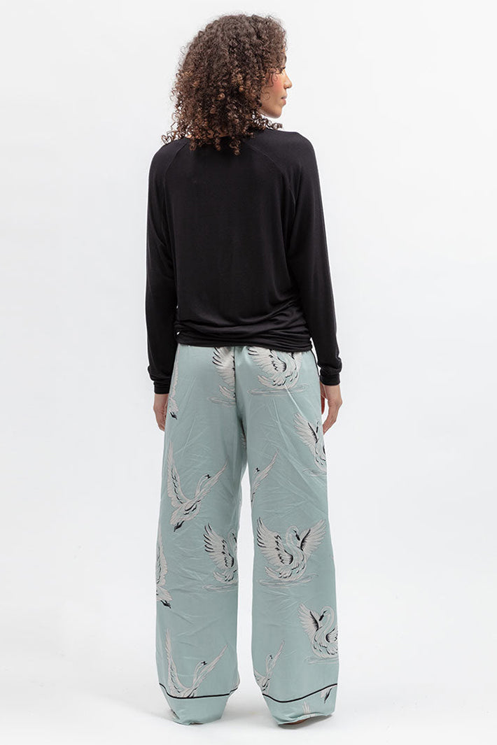Cyberjammies 5580 Grace Black Slouch Jersey Long Sleeve Pyjama Top, back view with pale printed bottoms