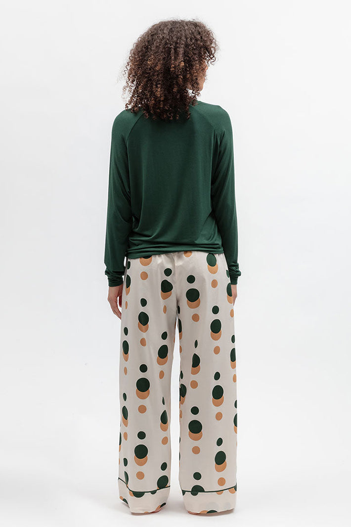 Cyberjammies 5656 Ember Dark Green Slouch Jersey Long Sleeve Pyjama Top, back view with printed wide-leg bottoms