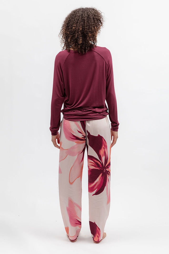 Cyberjammies 5688 Blush Botanica Berry Red Slouch Jersey Long Sleeve Pyjama Top, back view with floral bottoms