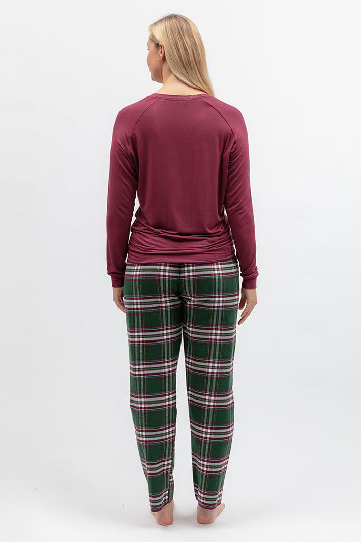 Cyberjammies Enchanted Nutcracker Green Brushed Check Pyjama Bottoms, back view with a berry top