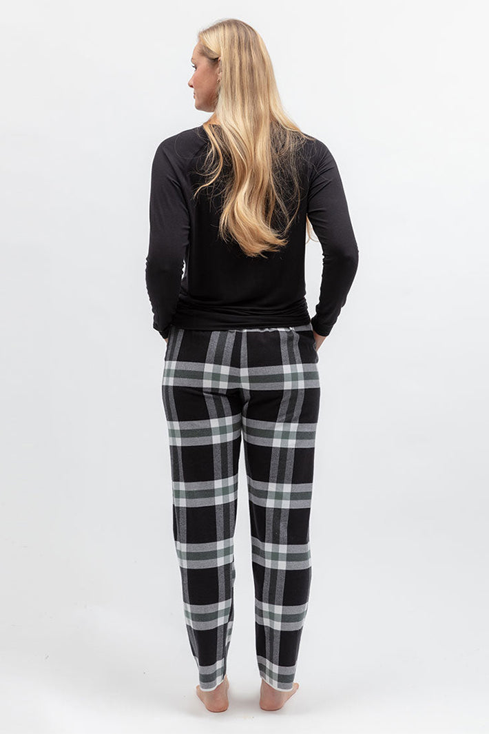 Cyberjammies Polar Drift Black Brushed Check Pyjama Bottoms, back view with a black top