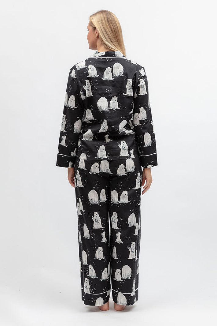 Cyberjammies Polar Drift Polar Bear Print Black Wide Leg Pyjama Bottoms, full-length back view with the matching top