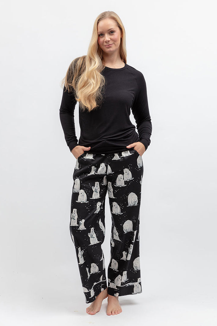 Cyberjammies Polar Drift Polar Bear Print Black Wide Leg Pyjama Bottoms, styled with a black top