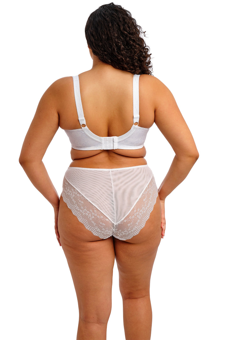 Woman wearing a white bra and panties set on a white background
