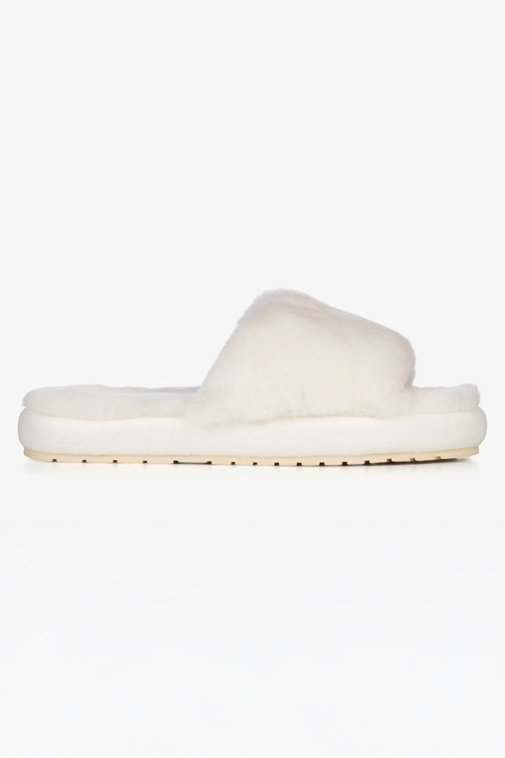 White fluffy slipper on a white background