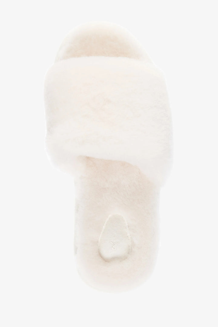 Close-up of a white fur hat with a soft texture on a light background