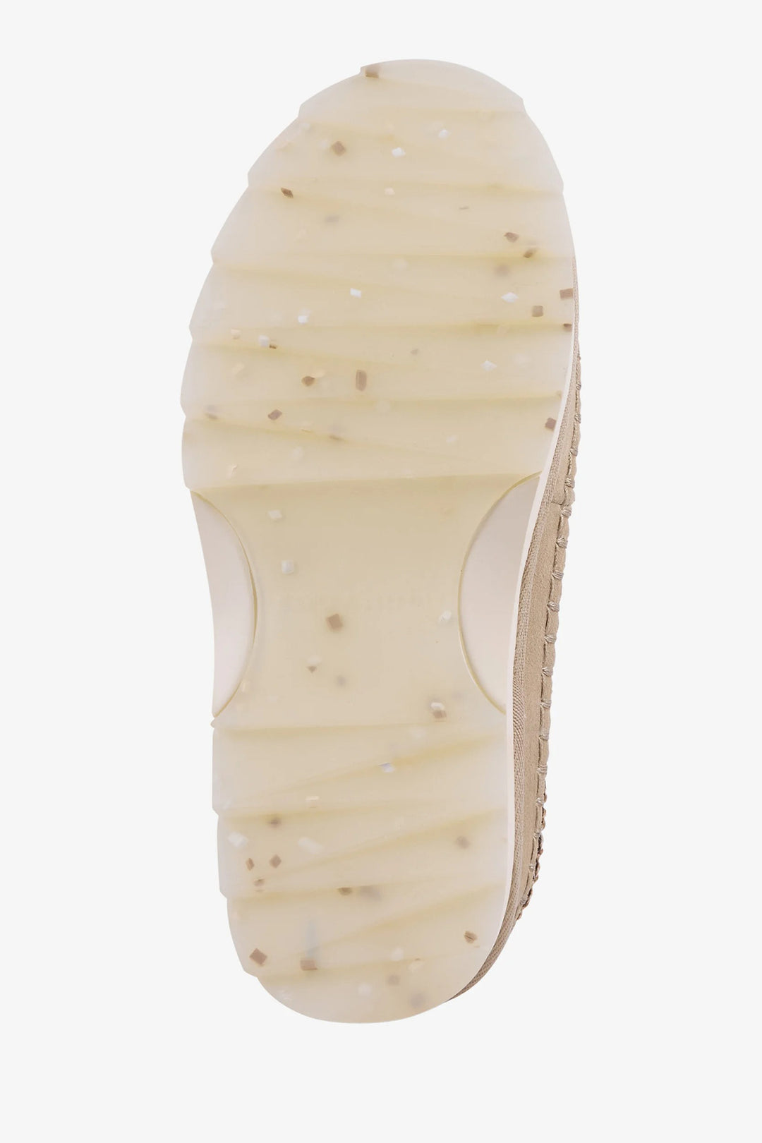 Close-up of a beige shoe sole on a white background