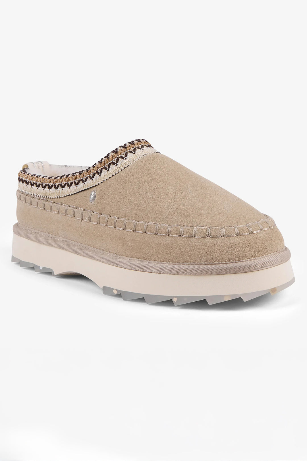 Beige slip-on shoe with textured sole on a white background