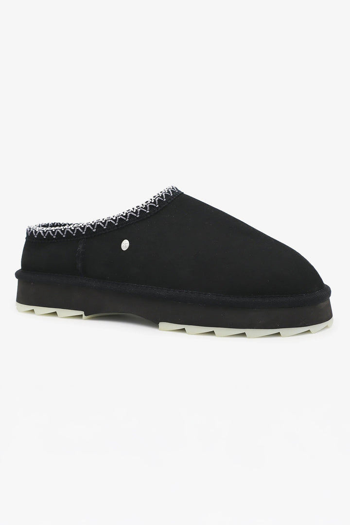 Black slipper with white sole on a white background