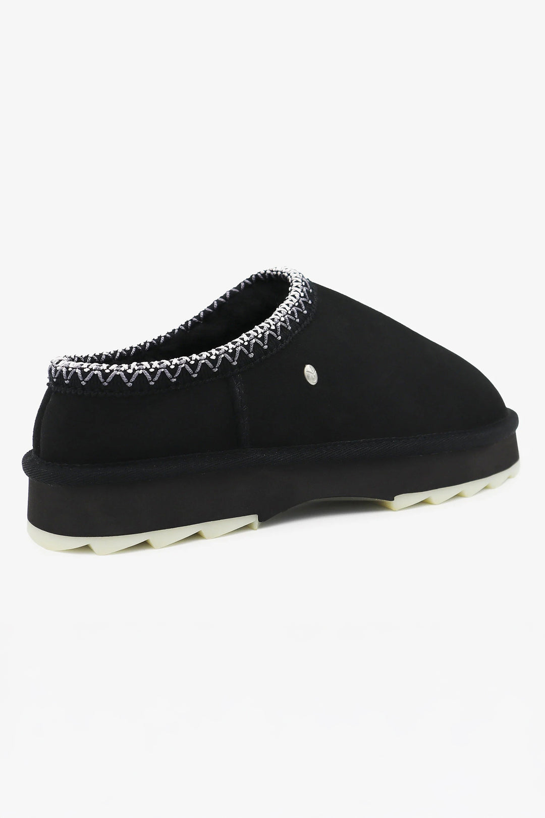 Black slipper with decorative trim on a white background