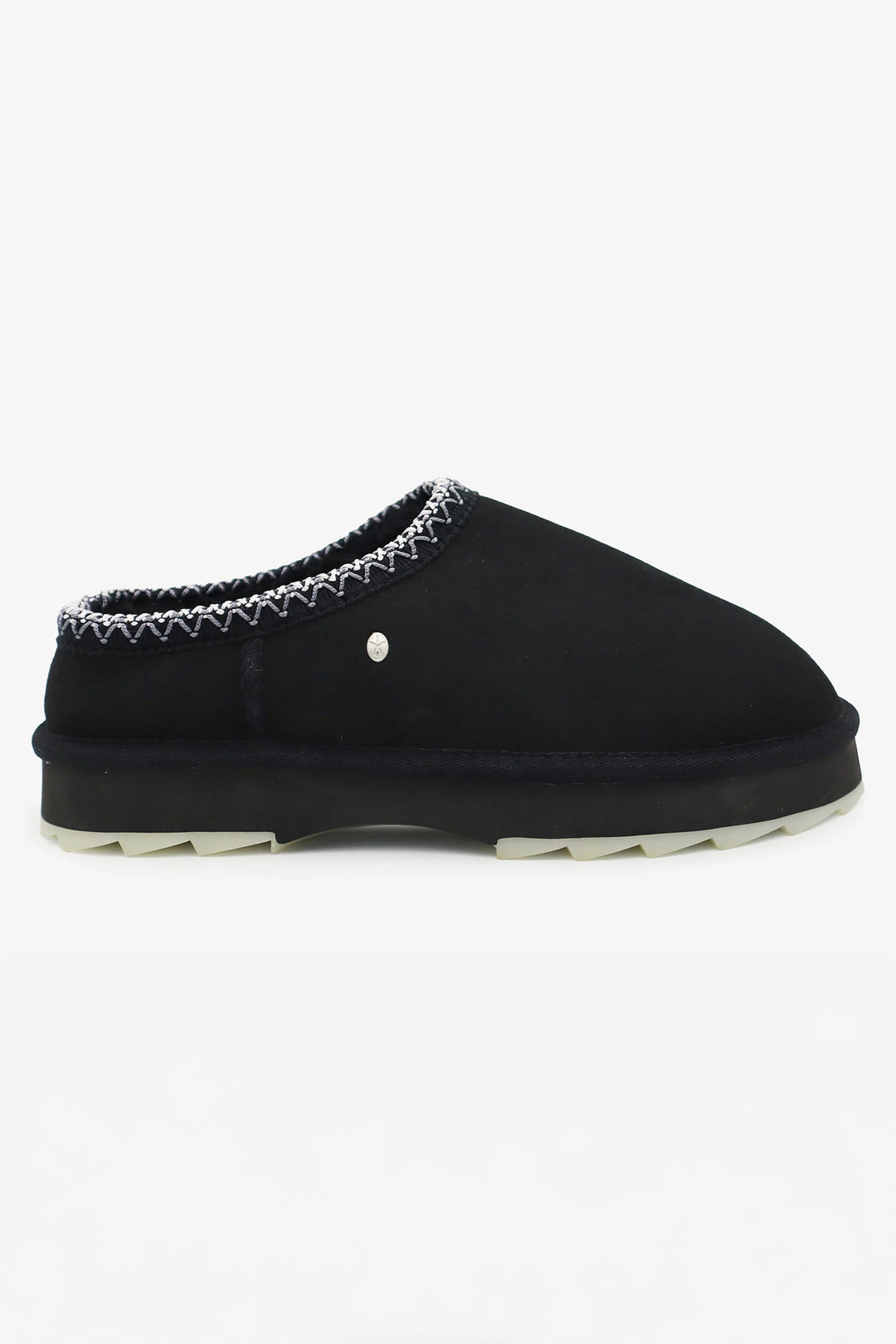 Black slipper with decorative trim on a white background
