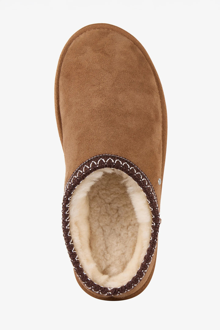 Brown suede slipper with a white interior on a white background