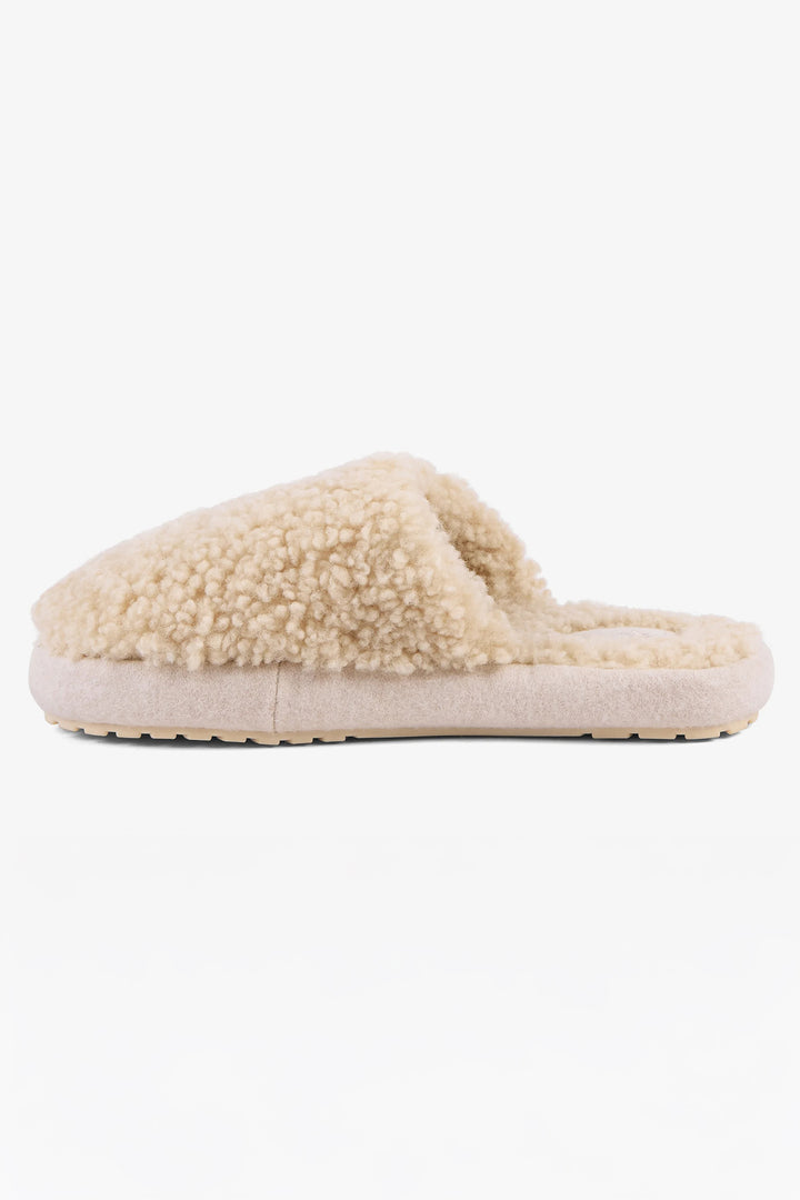 Beige slipper with fluffy texture on a white background