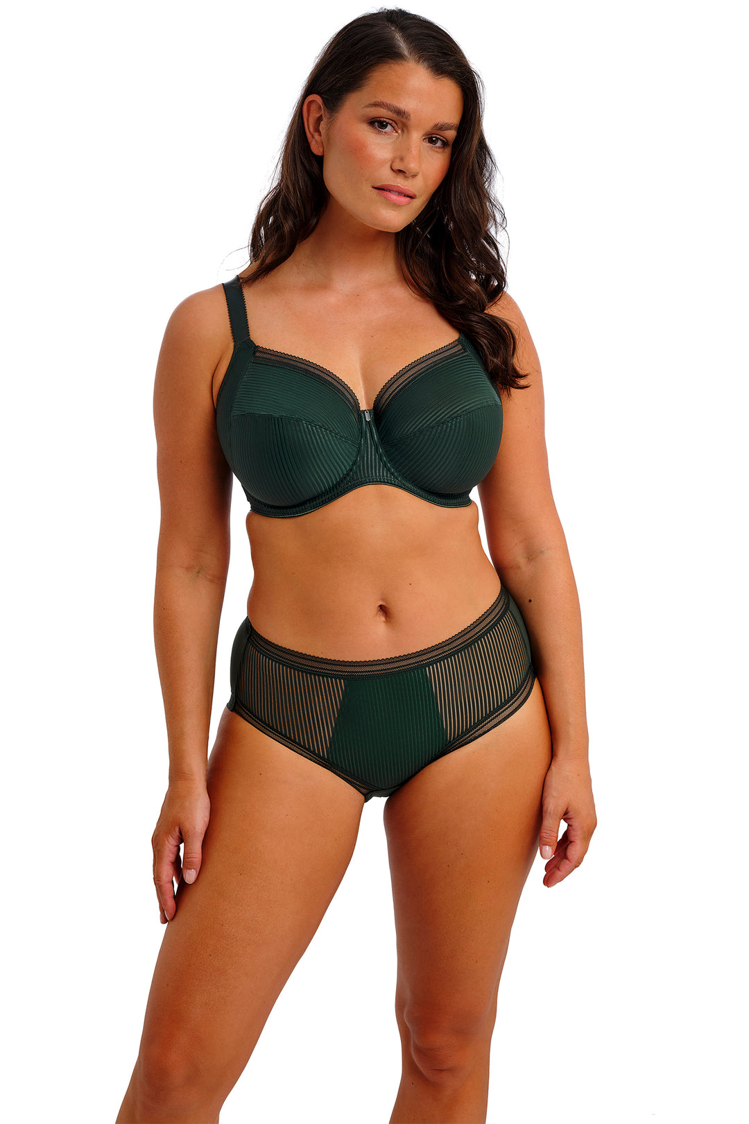 Woman wearing a green bra and panties set on a white background