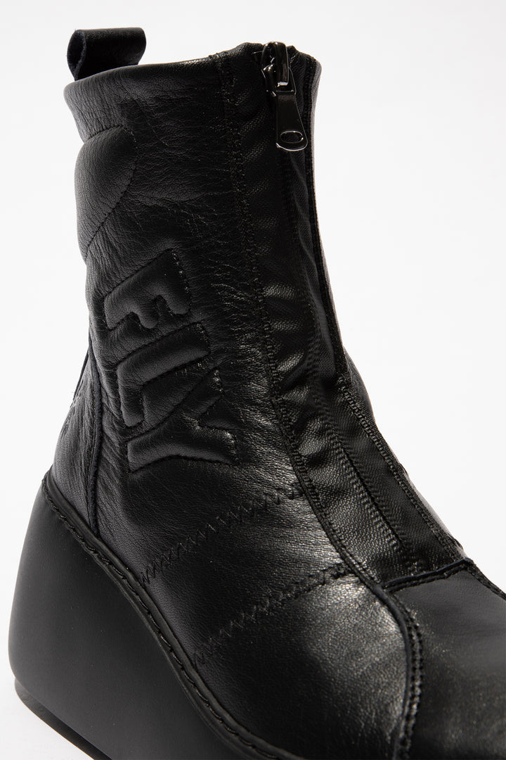 Black leather boot with a zipper on a white background