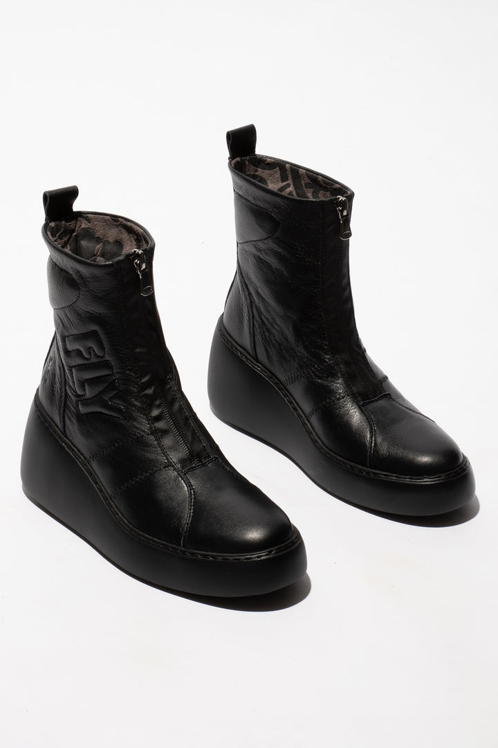 Pair of black leather boots on a white background