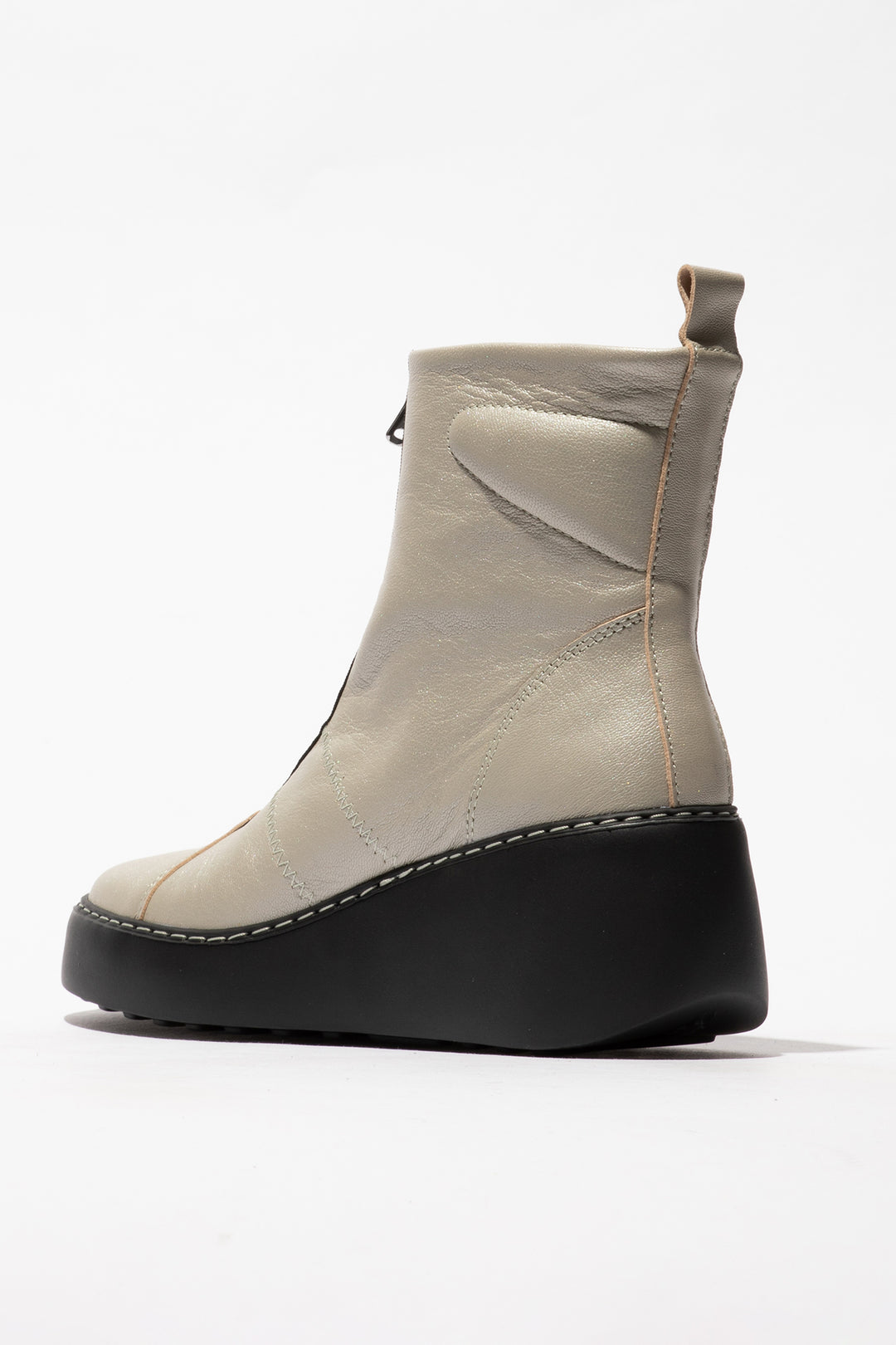 Beige ankle boot with black sole on a white background