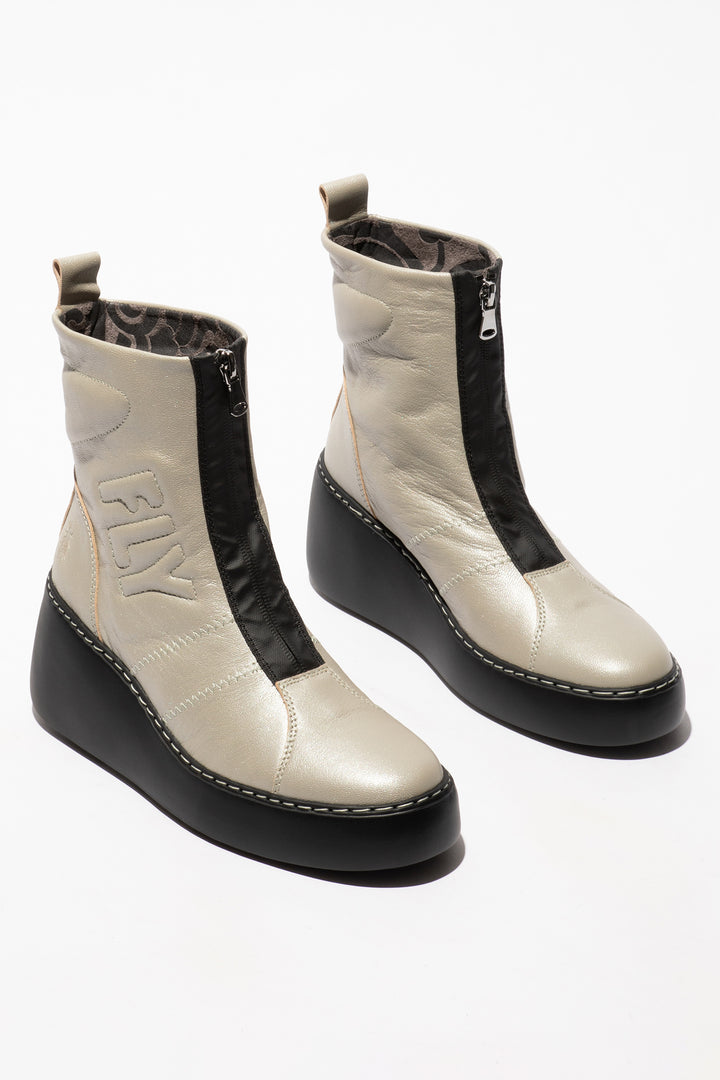 Pair of white and black boots on a white background